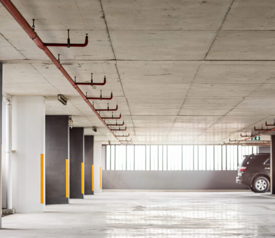 Empty parking lot in the daytime. Urban, industrial concept. Horizontal shot